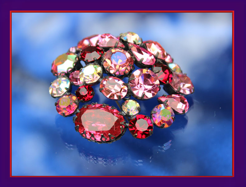 A sumptuous brooch of Siam, Ruby and Pink which shines from every angle.
