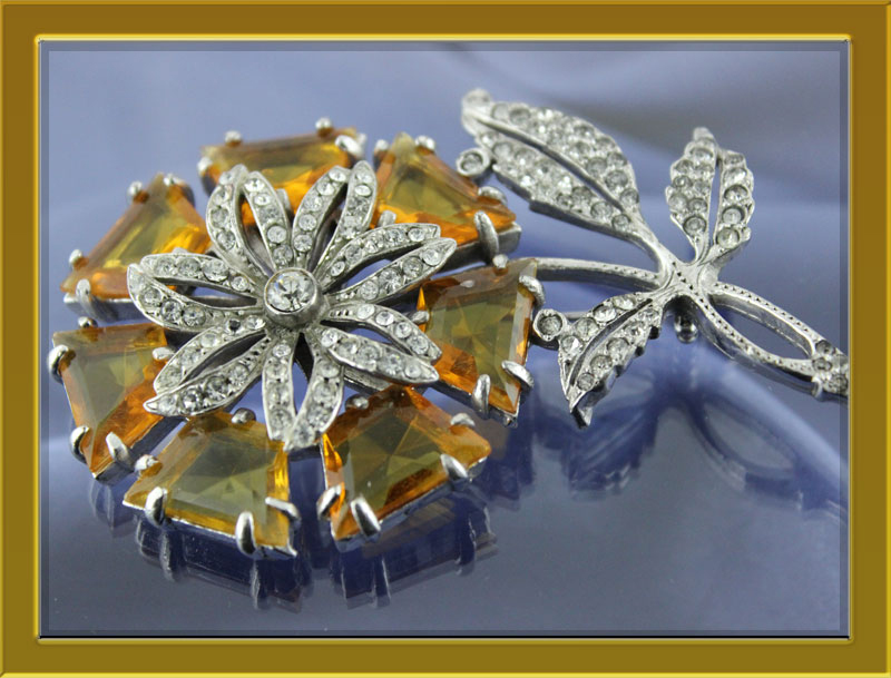 A rare Reinad find, a classic Art Deco Brooch of polygon shaped faceted amber glass.