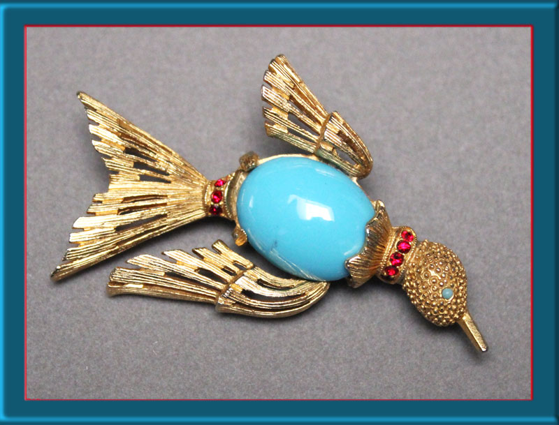 Benedikt-blue-belly-cab-and-ruby-rhinestone-bird-in-flight-brooch